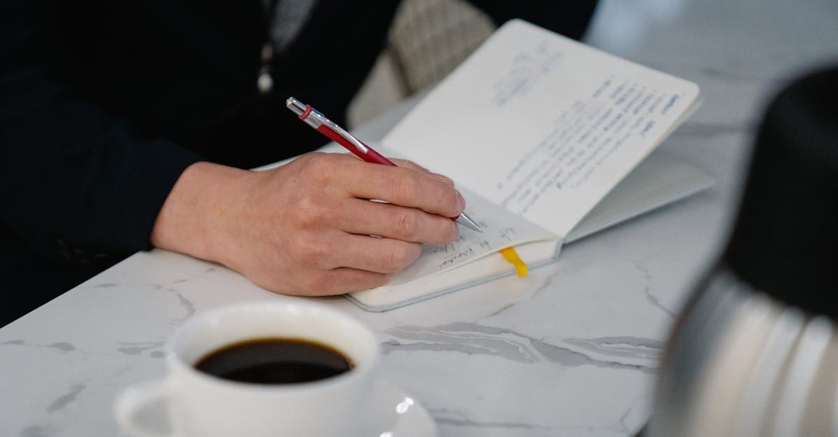 An adult sits at a desk with several browser tabs open, staring at the screen with a frustrated expression, unable to start the task in front of them.