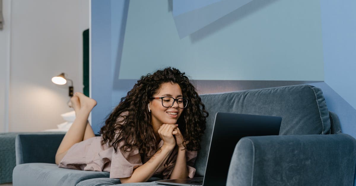 Person on a video call with a therapist on a laptop
